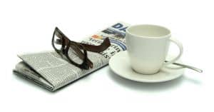 newspaper, glasses and cup